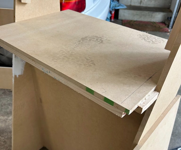 The internal shelf resting on 1x2 cleats to support the arcade controller